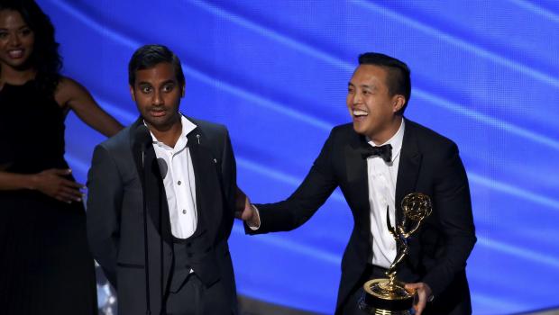 Ansari and Yang accept the award for Outstanding Writing For a Comedy Series at the 68th Primetime Emmy Awards in Los Angeles